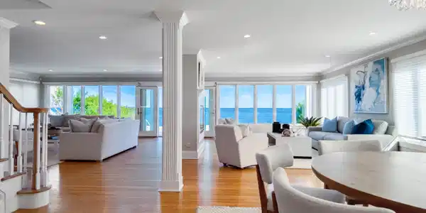Image 4: WIDE OPEN floor plan provides gorgeous 180 like degree views add day.....Dining room shown to the right w/ round table, however fits a larger farm table w/ seating for 10-12 easily (ask to see photo)