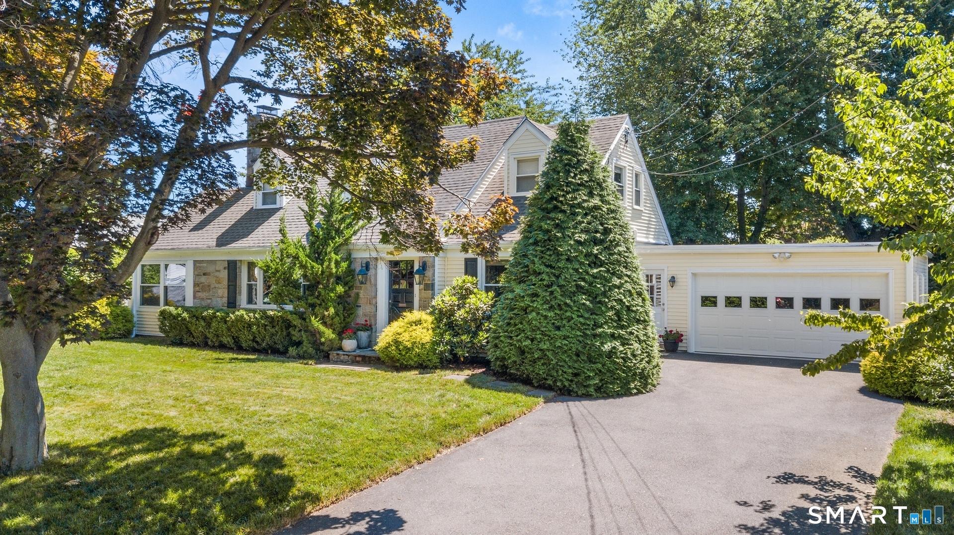 Image 2Front of House: 2 car garage with enclosed breezeway to main house