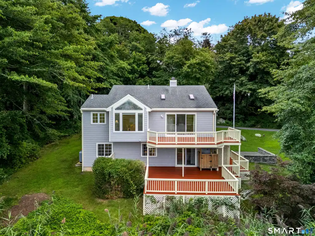 Image 1: Welcome to 81 Little Stannard Beach Road! Two expansive decks overlook the beautiful marsh.
