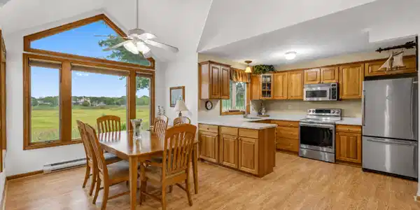 Image 4: Open concept kitchen with dining space. 