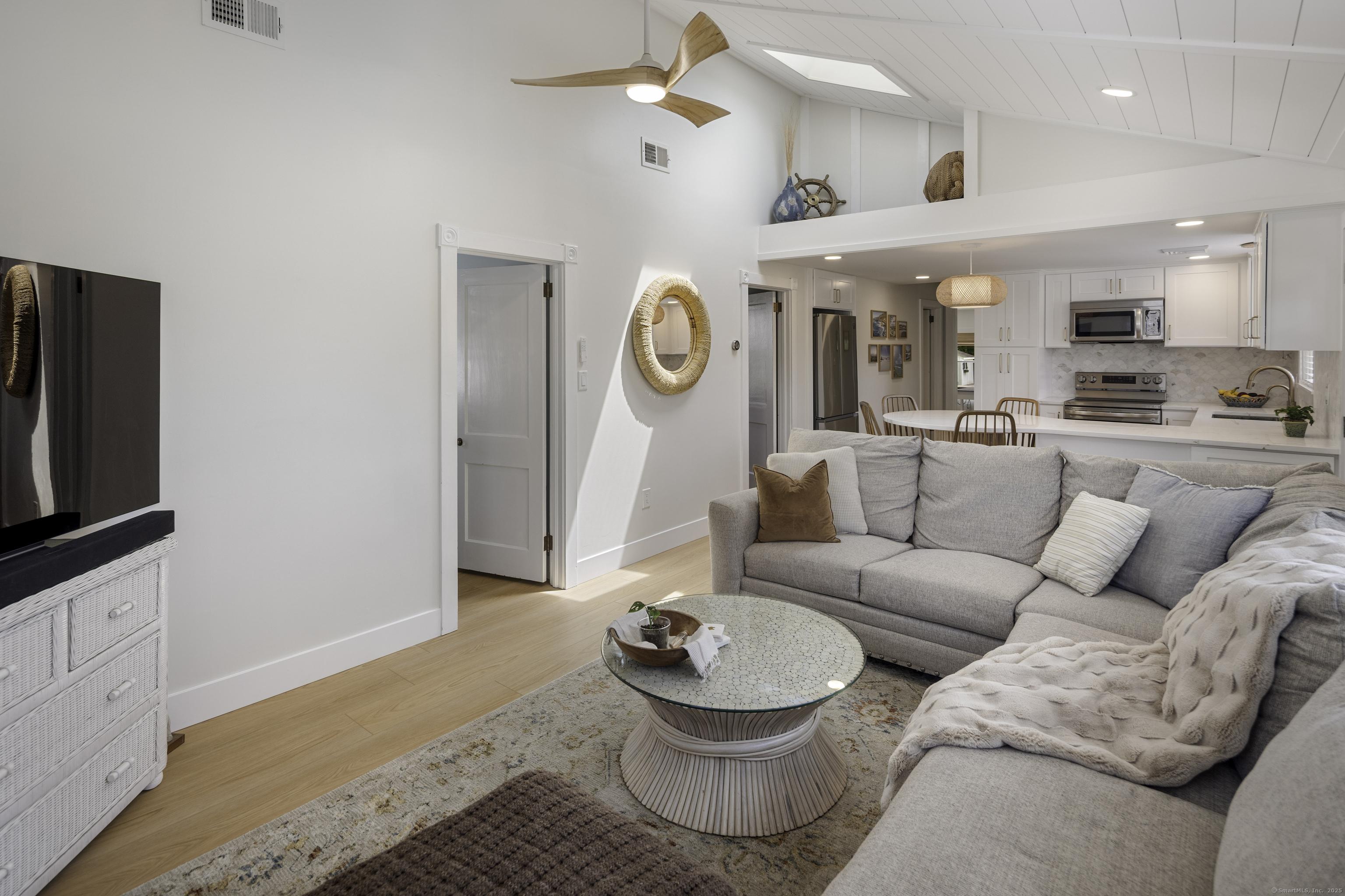 Image 3: Open family room and kitchen