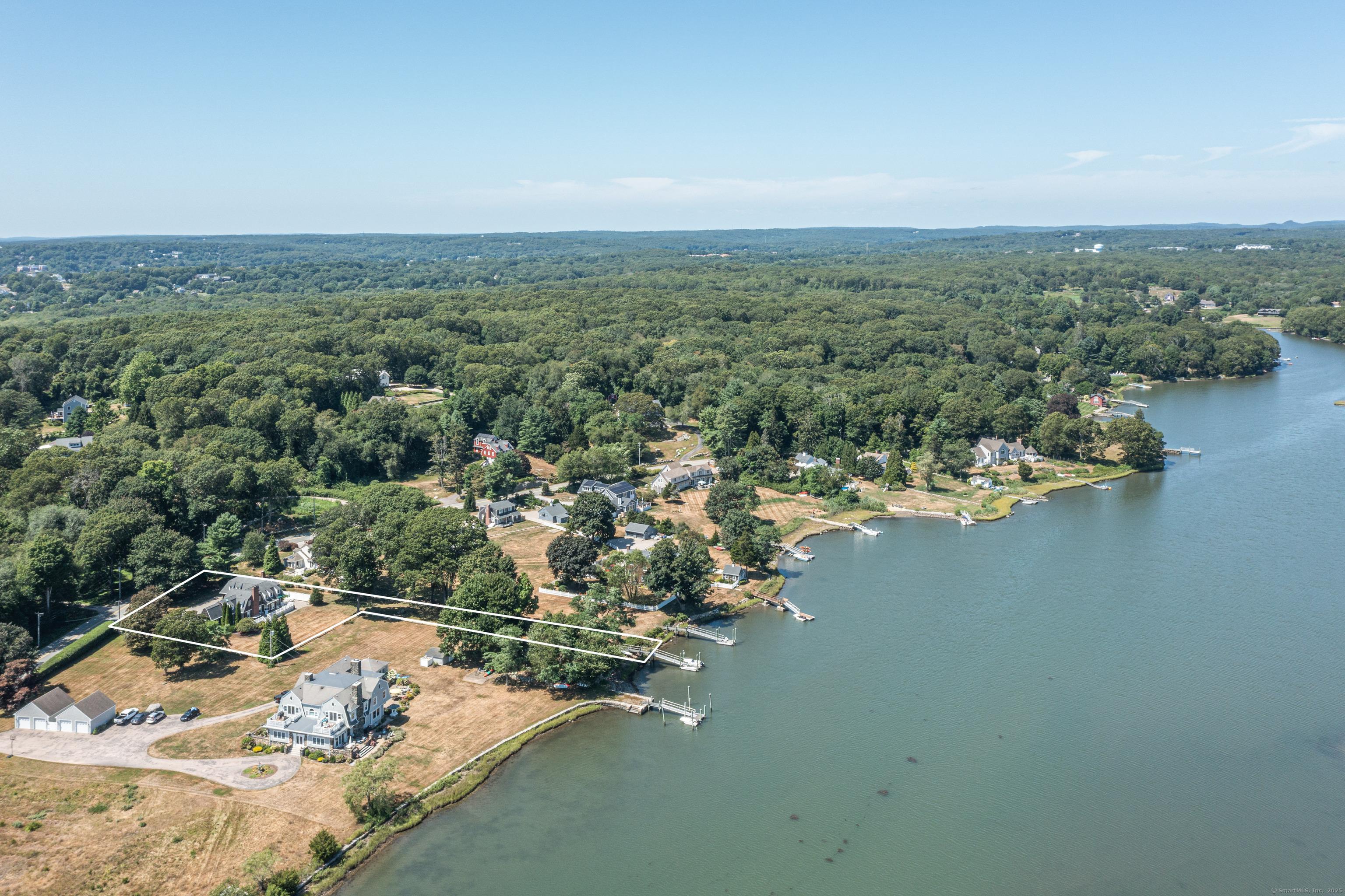Image 1: Direct Waterfront. 3 Bedroom, 3 and 1/2 Bath Custom Colonial nestled on .93 manicured Acres with 47' of water frontage on Quiambaug Cove with Private Ipe Dock.