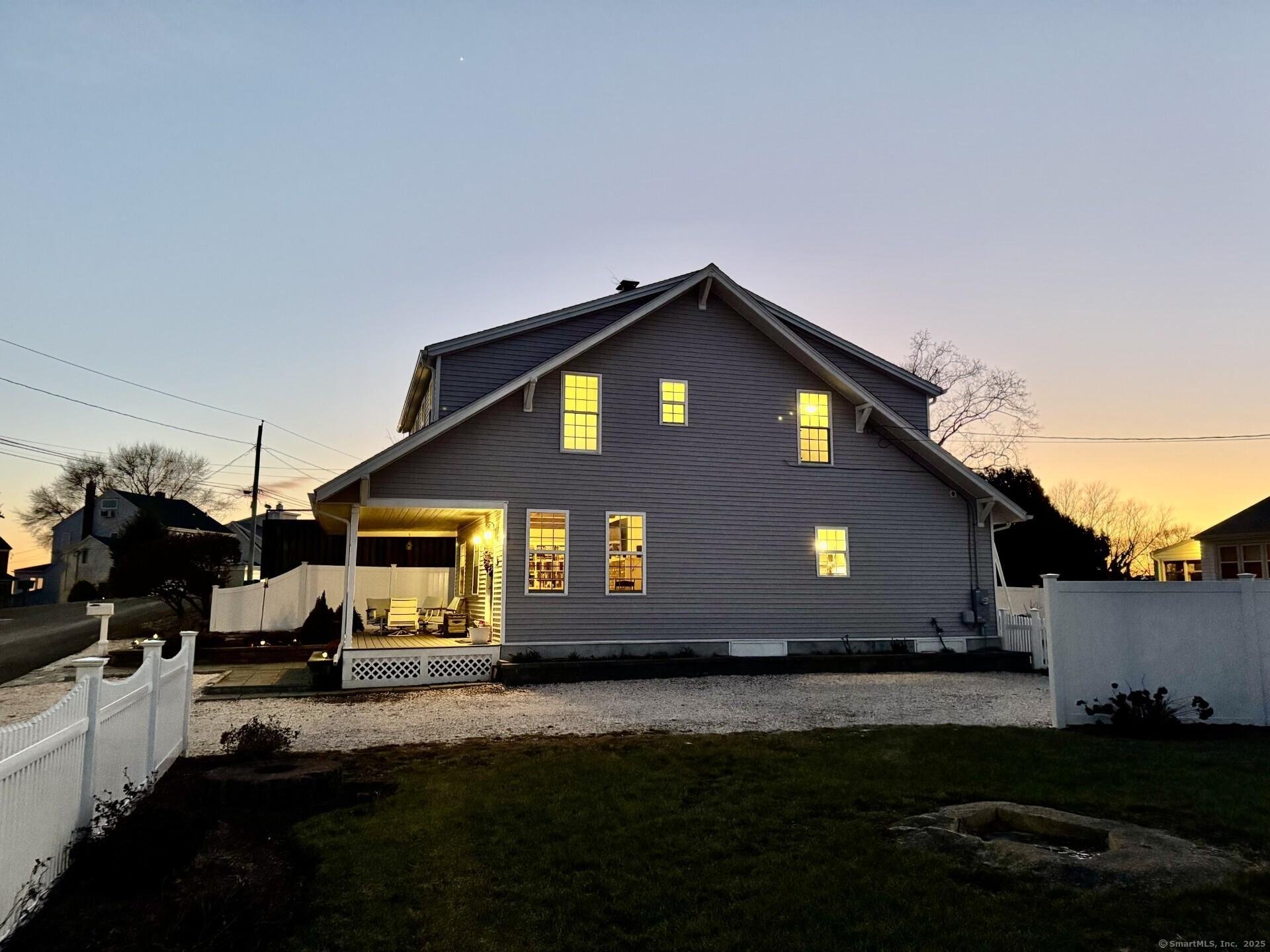 Image 3: This 1800+ square foot home, set on .26 acre park-like grounds offering multiple gathering areas for outdoor enjoyment! Summer 2026 could be your best ever!