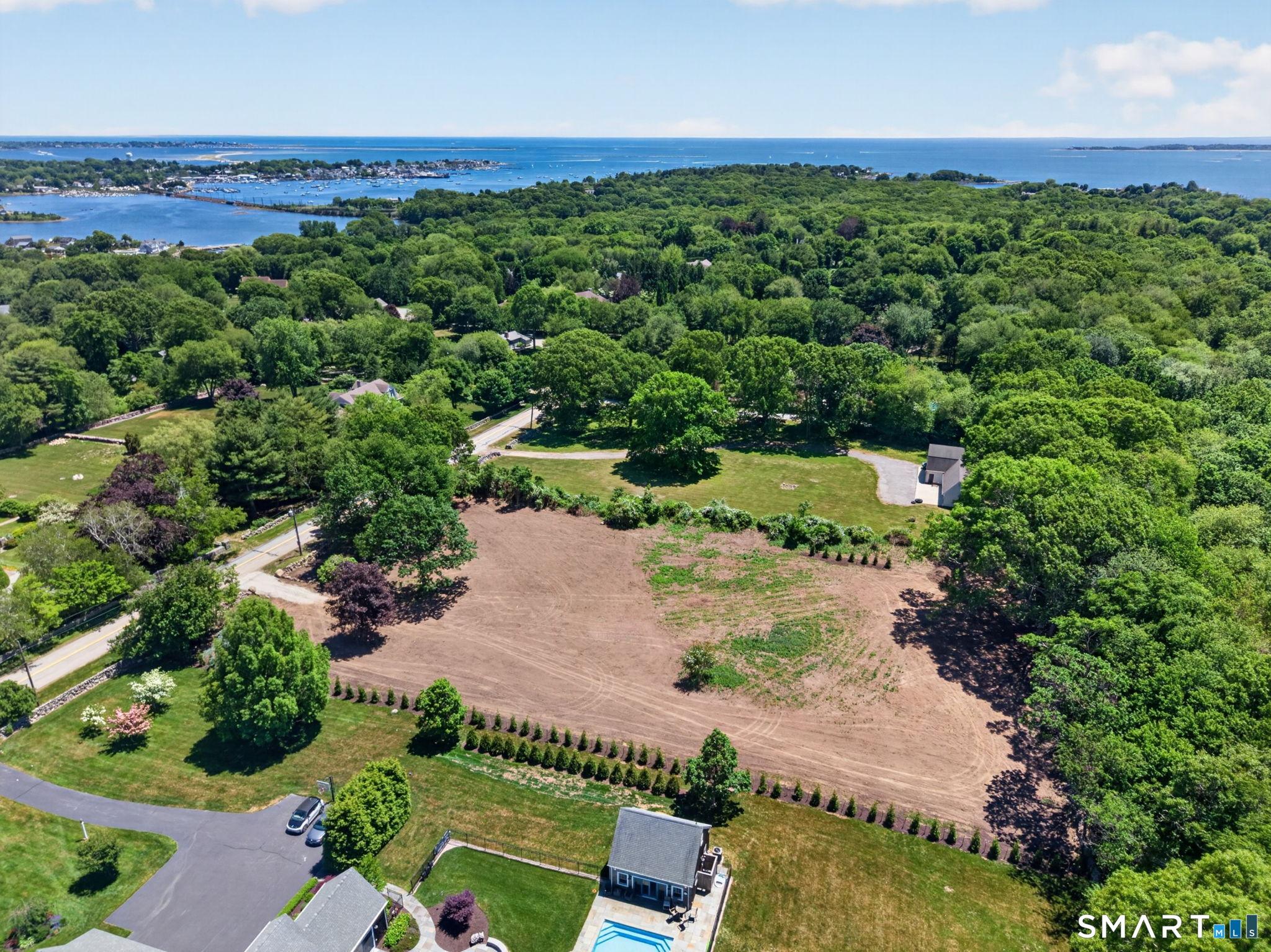 Image 2: Cleared, level and planted 1.89 acre lot with approx. 203 feet of road frontage on Montauk Avenue.