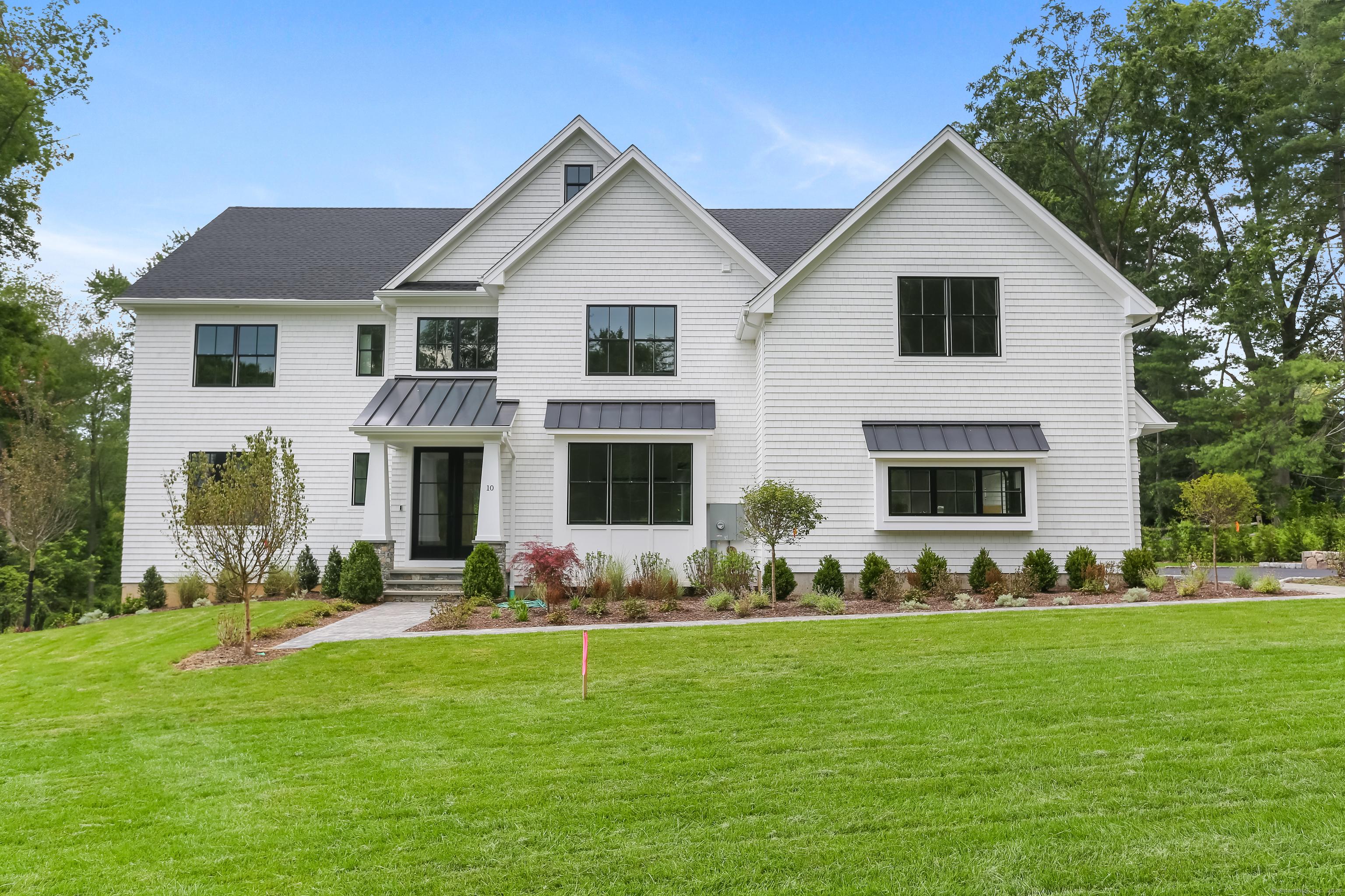 Image 1Front of House: Beautfully sited on 1.4 acres