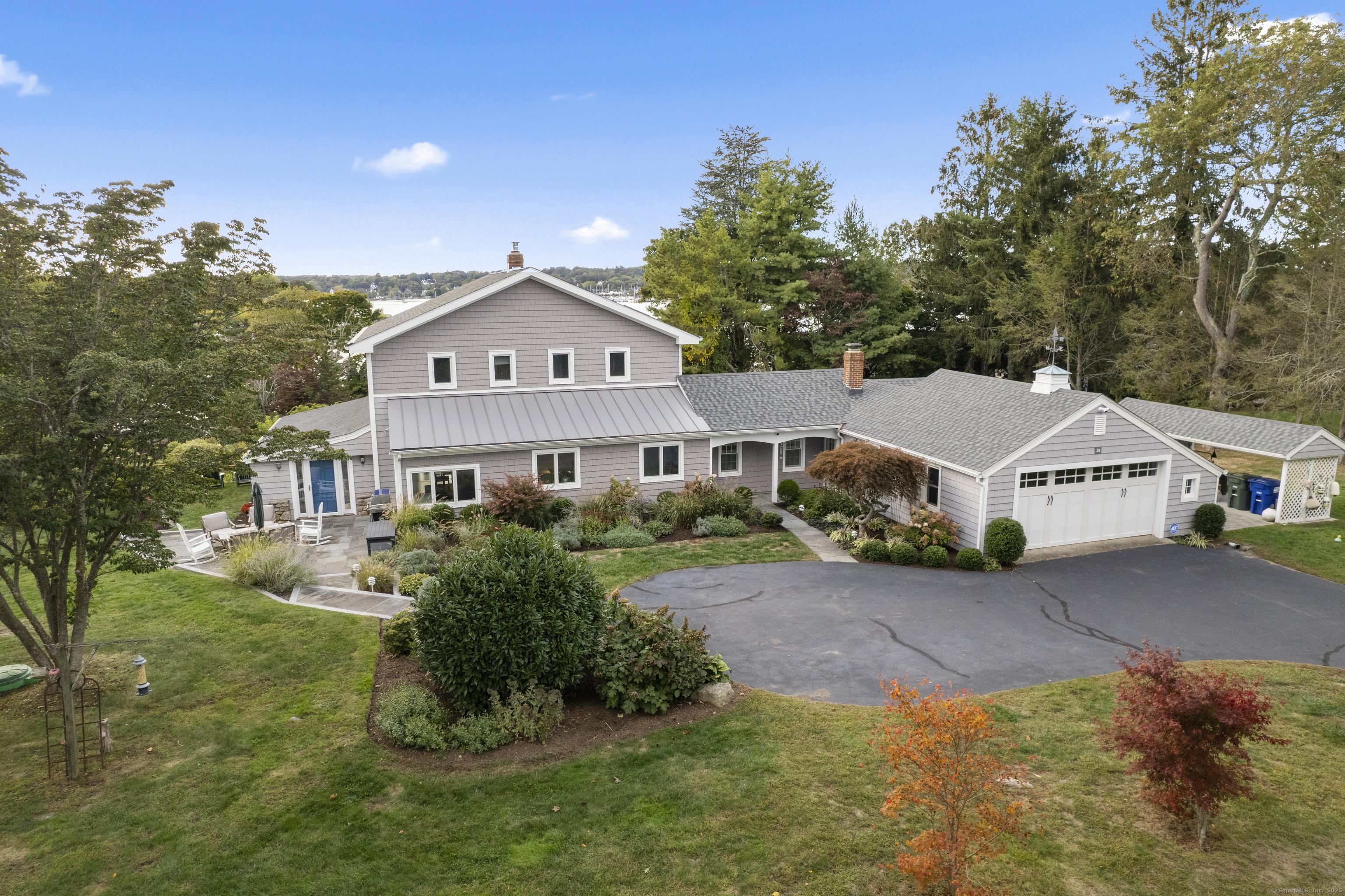 Image 2: Beautifully renovated 4 Bedroom, 2.5 Bathroom Home nestled on .88 acres with lovely water views from almost every room.