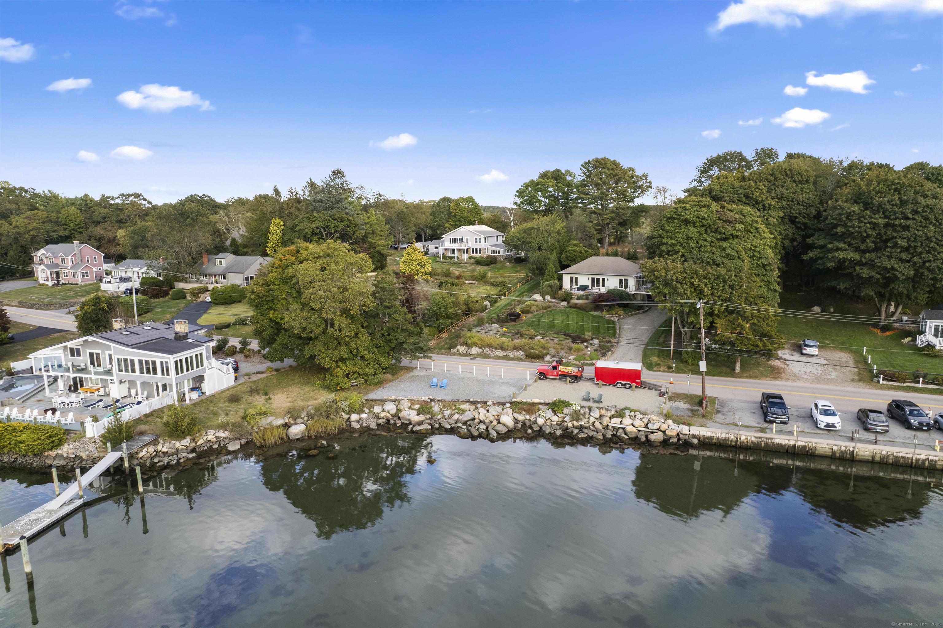 Image 3: Separate .08 acre Water Front parcel with 50' of water frontage on Masons Island Road conveys.