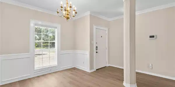Image 3: Looking at Entryway from Dining Room Entry