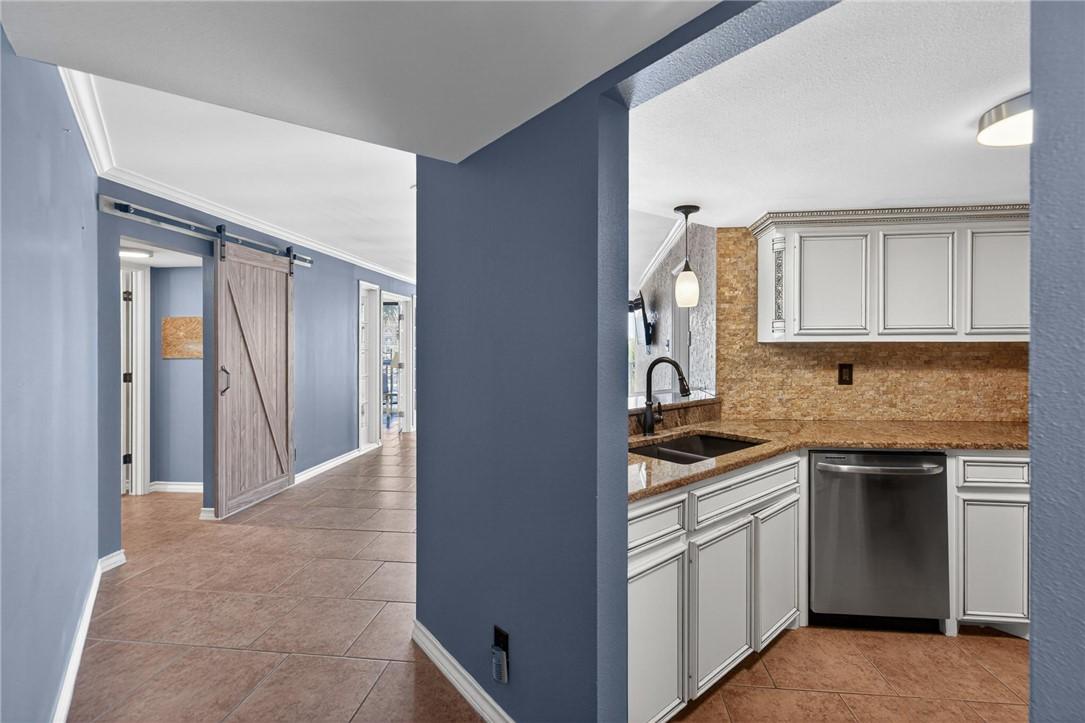 Image 4: Entry hall way - views towards kitchen and living