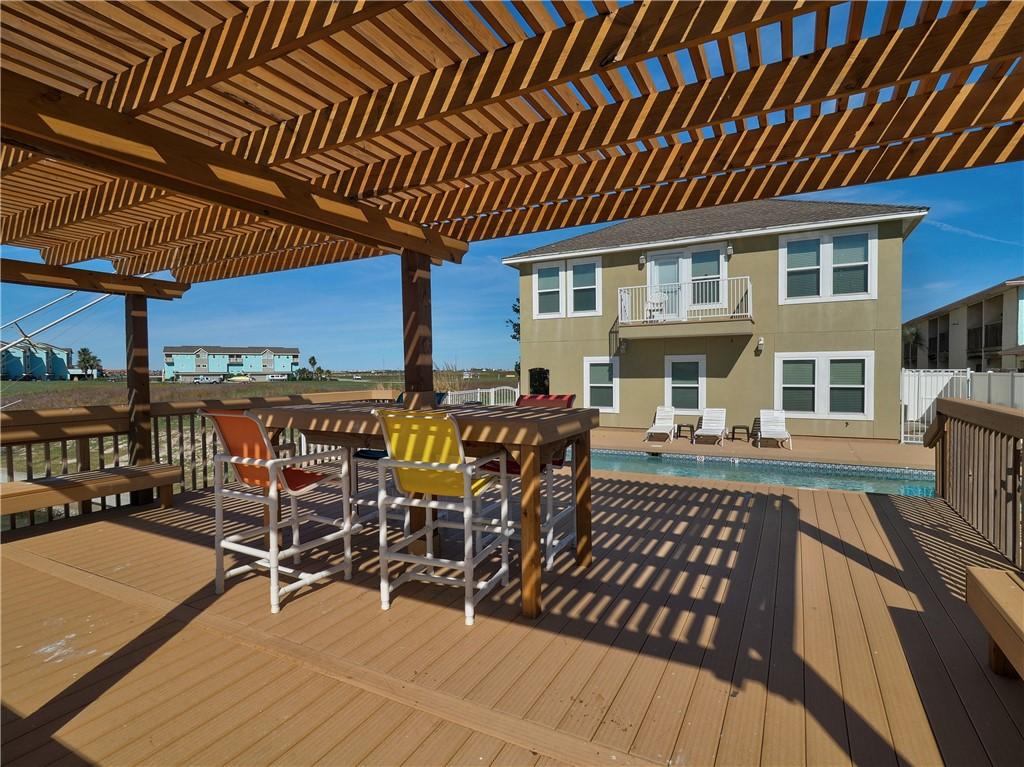 Image 4: Deck with pergola overlooking pool and Packery Cha