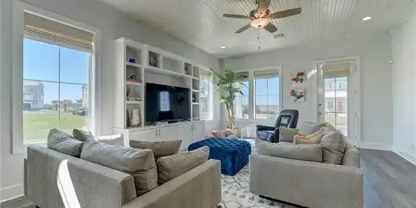 Image 3: Natural light in this living room offers a great p