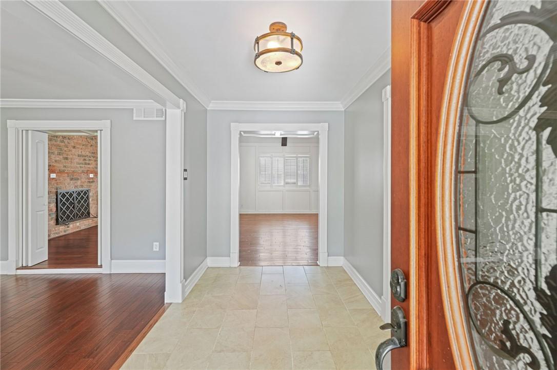 Image 3: Entry opens to dining room on the left and lower-l