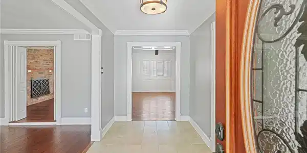 Image 3: Entry opens to dining room on the left and lower-l