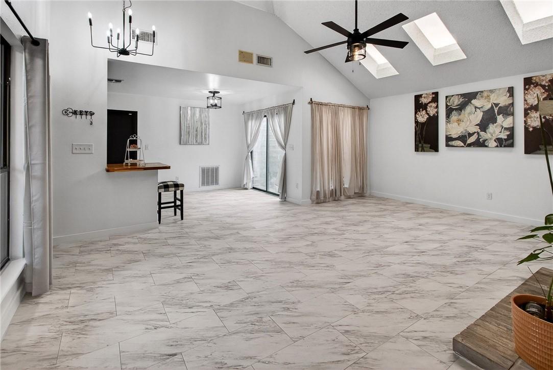 Image 3: The vaulted ceiling and skylights fill the space w