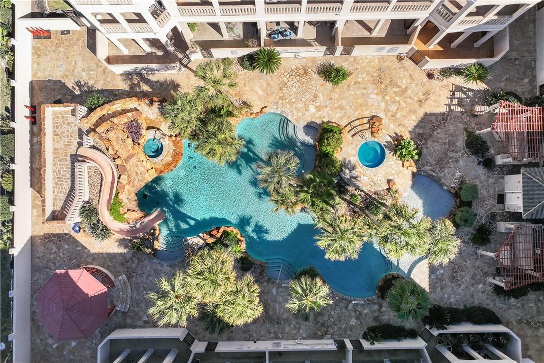 Image 3: Luxury resort pool with waterslide.