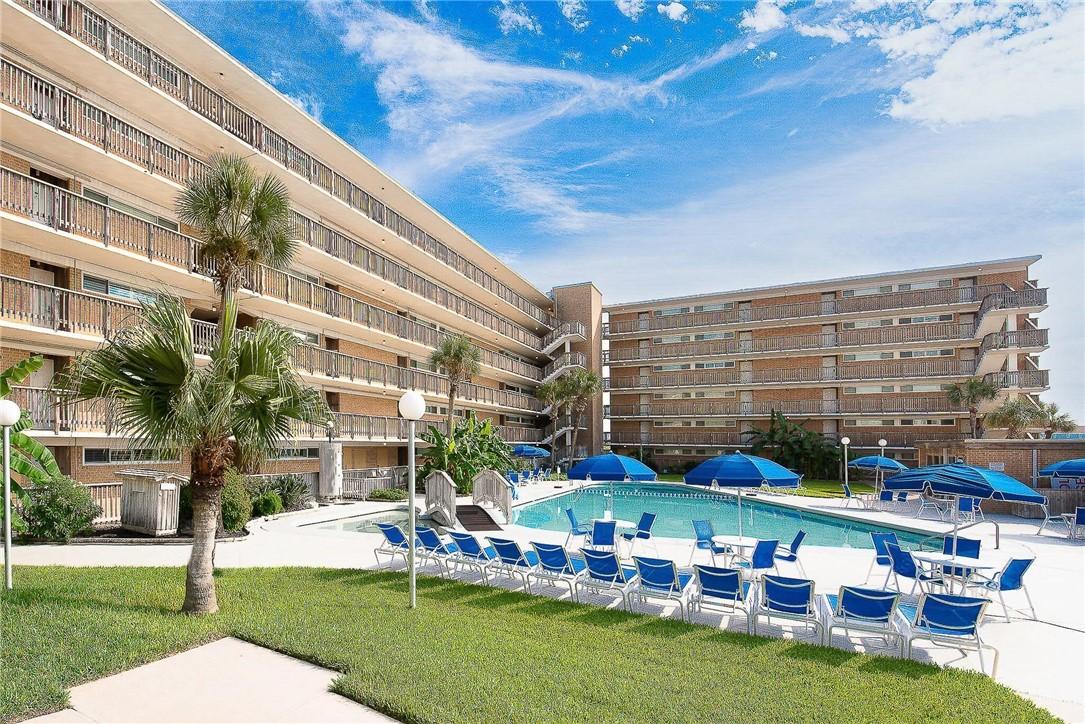 Image 3: View of pool and Unit 221 building
