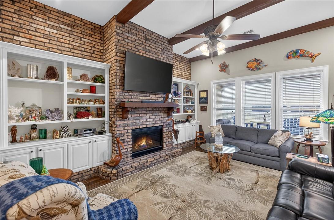 Image 4: Living area with gas fireplace.