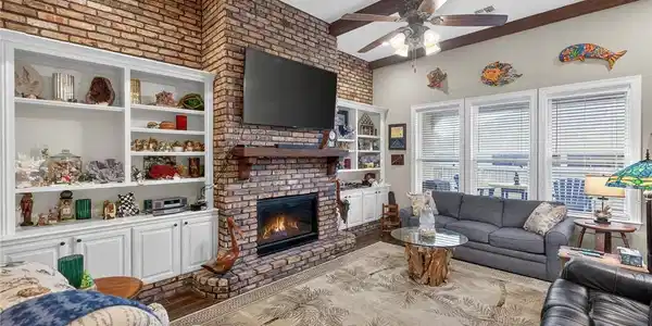 Image 4: Living area with gas fireplace.