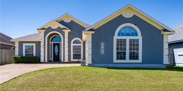 Image 2: Front exterior view of 6825 Island Park in Manhatt
