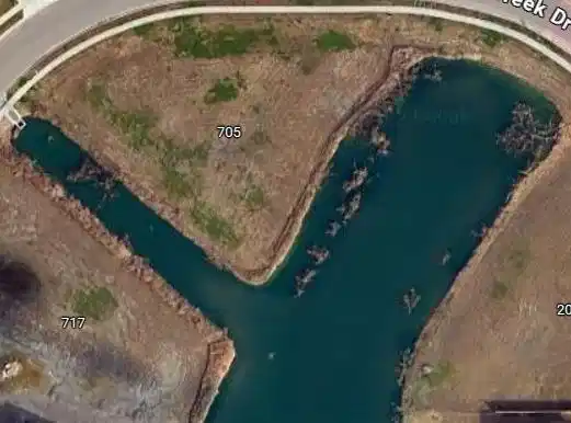 Image 1: 705 Battle Creek is a triangle with water on two s