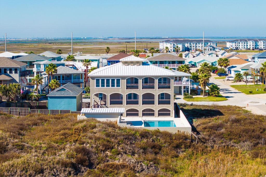 Image 4: The back of the home offers amazing views.