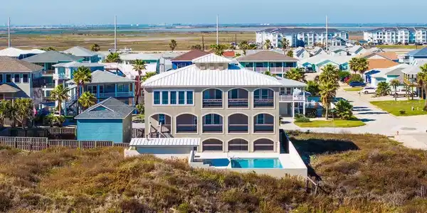 Image 4: The back of the home offers amazing views.