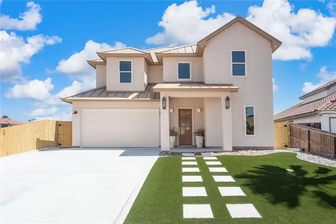 Image 1: Landscaped with turf, pavers & rocks