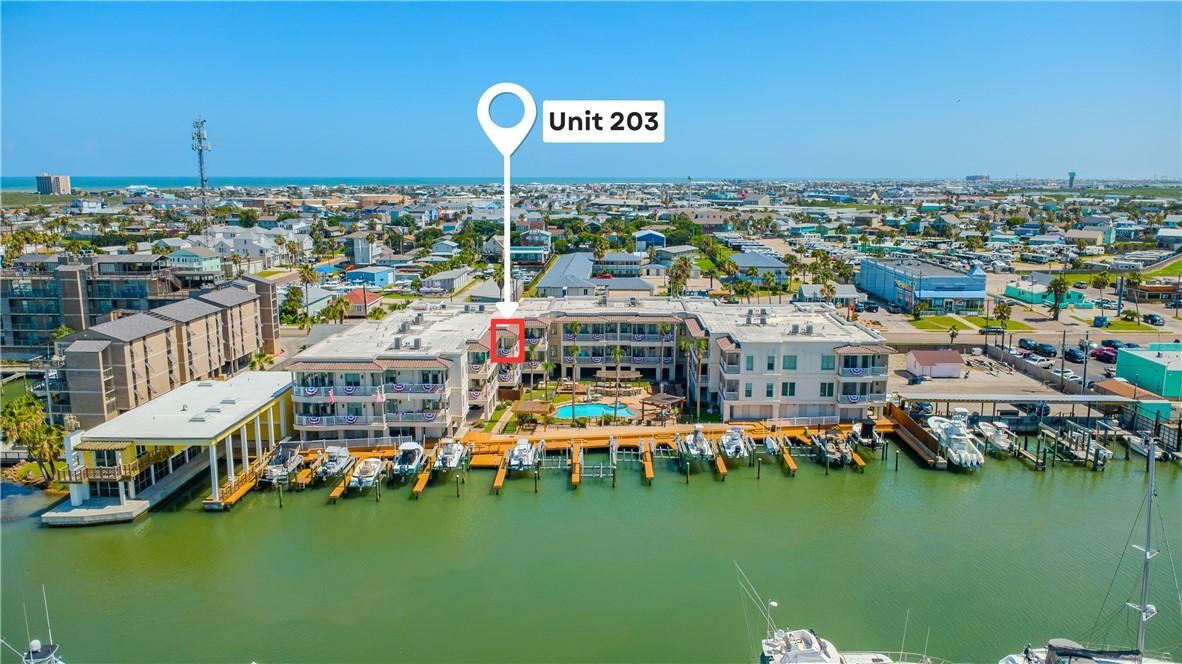 Image 2: Unit 203, building, neighborhood and boat slips