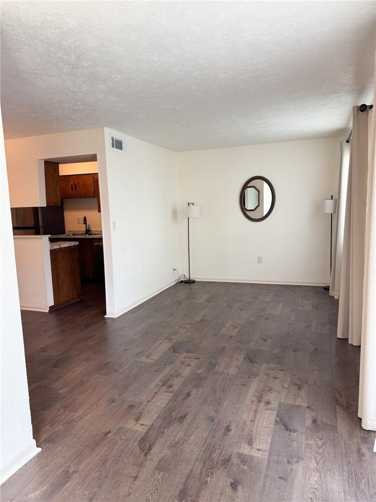 Image 2: Front entry opens directly into the bright living