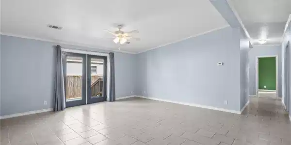 Image 2: Living room with french doors to back yard