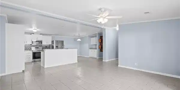 Image 3: Open concept living, kitchen, and dining room