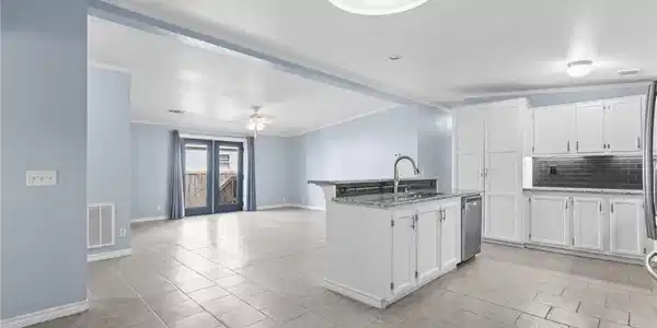 Image 4: Kitchen and living area looking towards french doo