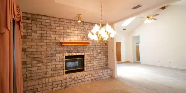 Image 4: Formal dining room has double sided fireplace.