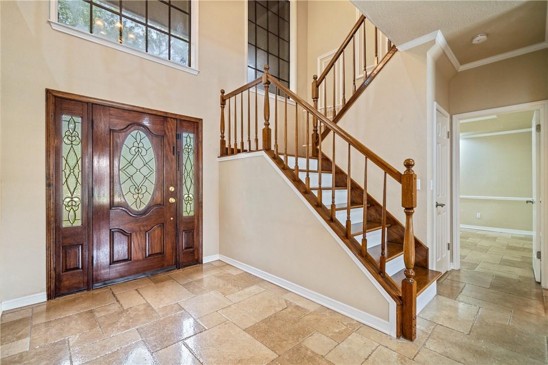 Image 4: Entryway with rich wood trim and accents