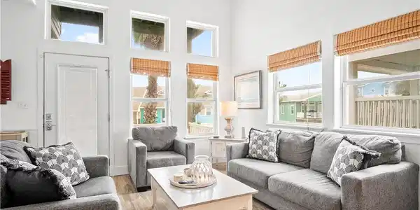 Image 2: View of living room from bottom of stairs