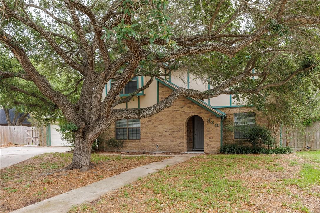 Image 1: Arrive at this stately two-story residence, framed