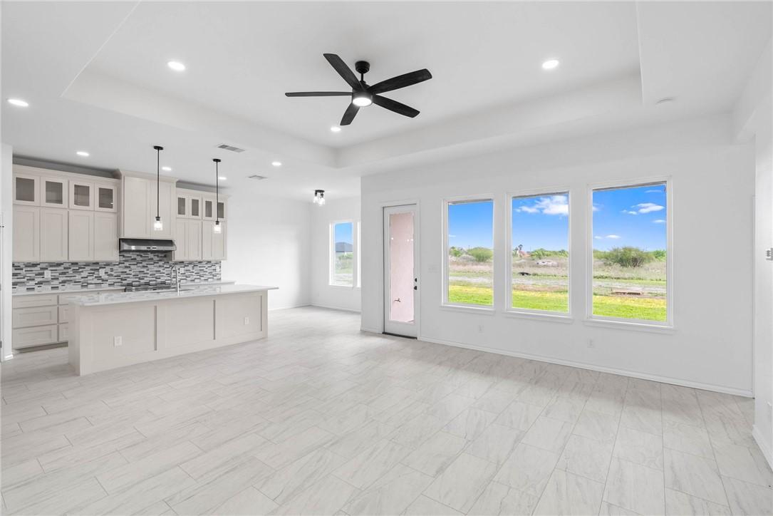 Image 4: View of Kitchen and dining area from living room