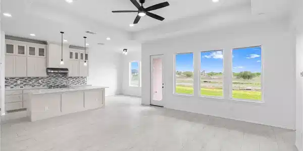 Image 4: View of Kitchen and dining area from living room