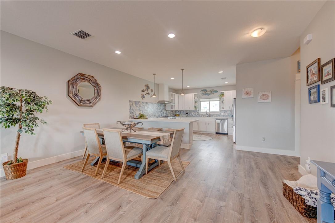 Image 2: Open kitchen, dining, living.