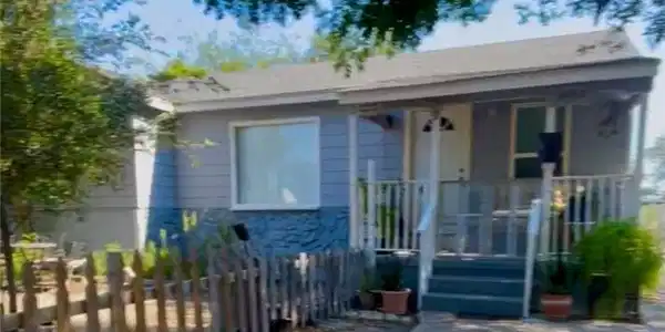 Image 2: Inviting entry surrounded by mature tree, charming