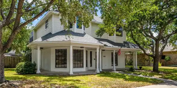 Image 3: Sprawling wrap-around covered porch spanning front