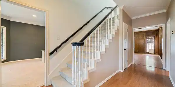 Image 4: Inviting grand entry foyer showcasing warm tones,