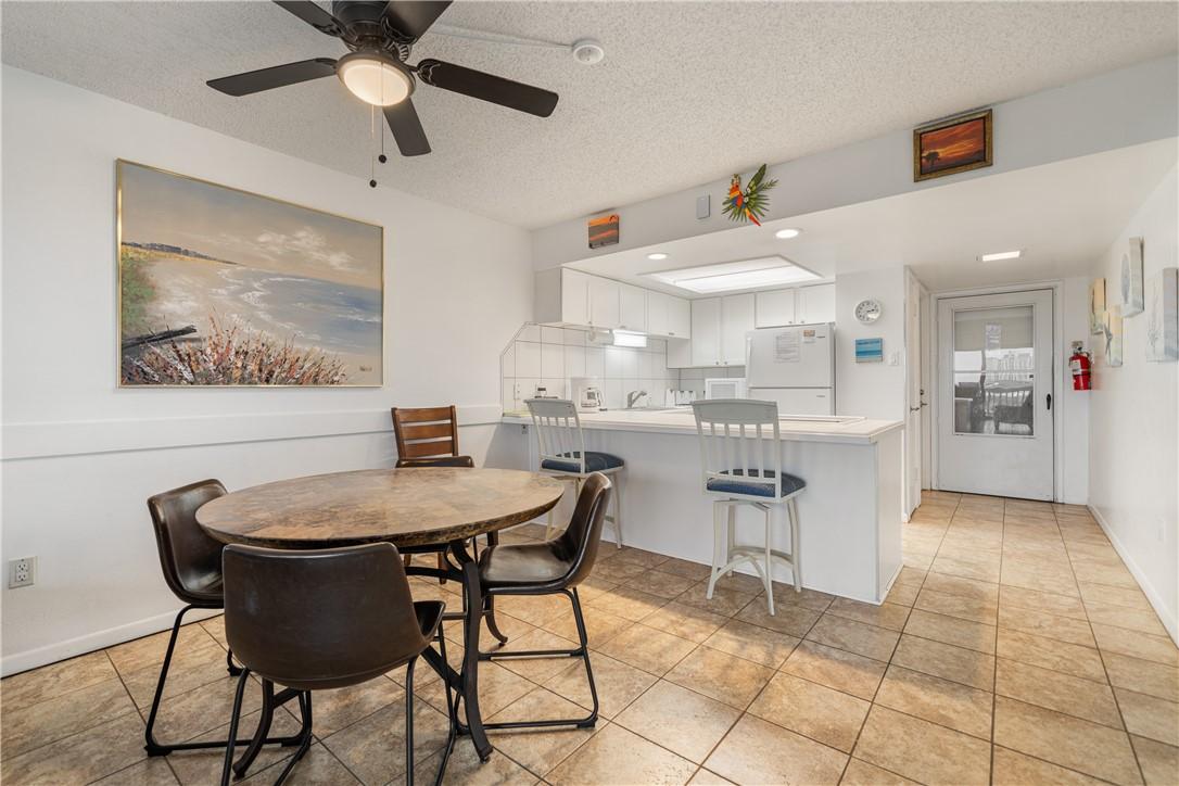 Image 3: Dining Area and Kitchen