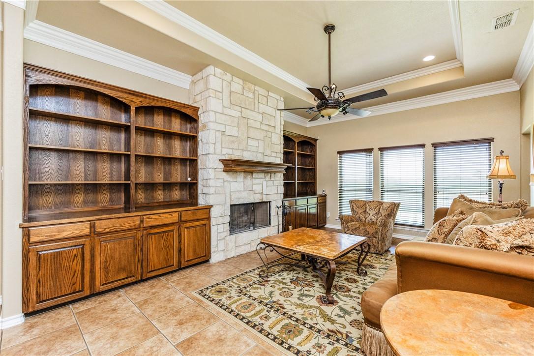 Image 3: Formal Living Area with Hardwood Built-Ins and Woo