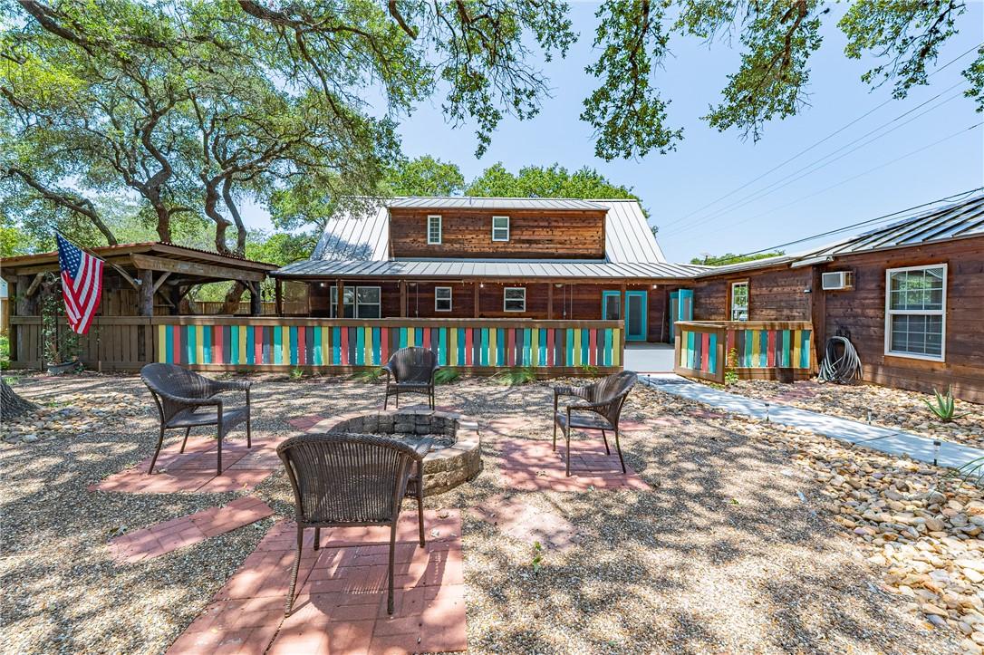 Image 2: Towering live oak trees and a spacious backyard cr