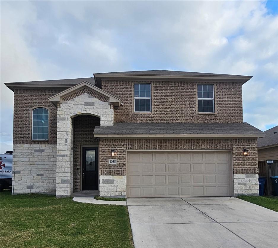 Image 1: Located on a cul-de-sac, this two-story home does