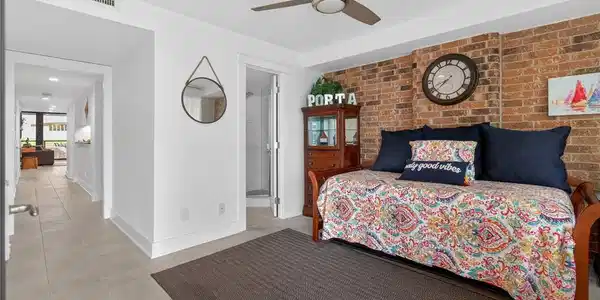 Image 4: Entry den and bathroom.