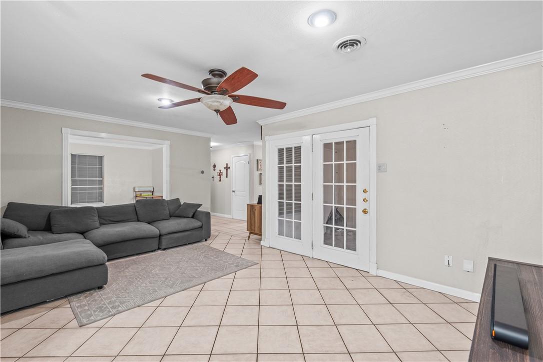 Image 3: Tiled Living Area, Recessed Lighting, French Doors