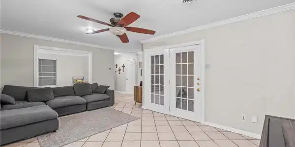 Image 3: Tiled Living Area, Recessed Lighting, French Doors