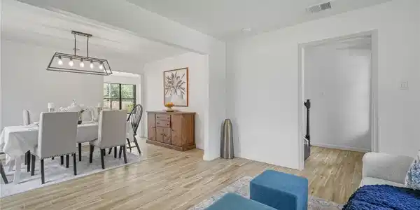 Image 4: Front sitting room flows into the formal dining ar